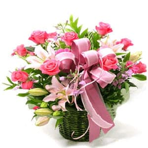 Pink roses and lilies in basket